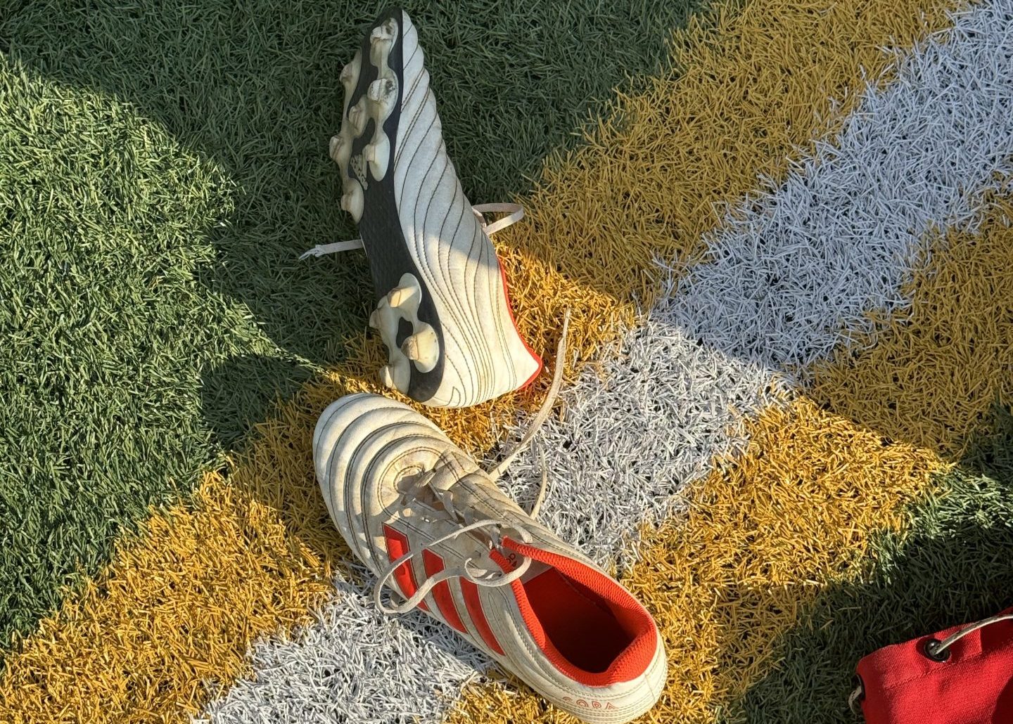 football boots on football field